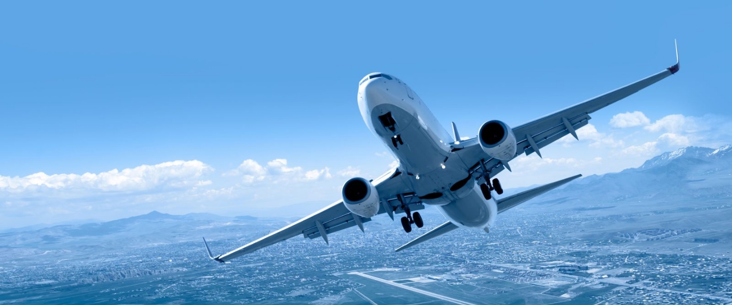 Airplane flying with a city background